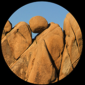 Rocks - like puzzle pieces silouetted against a blue sky, Joshua Tree National Park, California, USA
